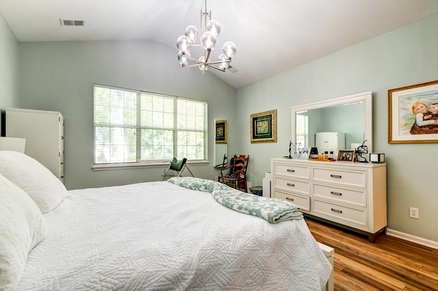 1231 Wild Olive Dr, Mount Pleasant, SC 29464 - bedroom with vaulted ceiling, a chandelier, wood finished floors, multiple windows, and baseboards