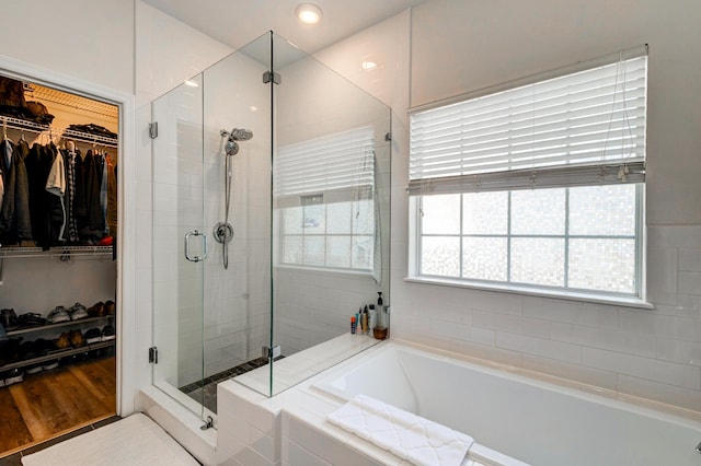 1231 Wild Olive Dr, Mount Pleasant, SC 29464 - bathroom featuring a stall shower, a spacious closet, and a bath