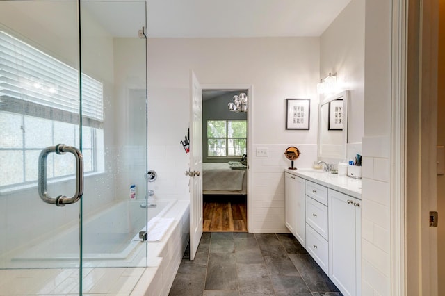 1231 Wild Olive Dr, Mount Pleasant, SC 29464 - full bath with ensuite bathroom, vanity, a shower with door, a bath, and wainscoting