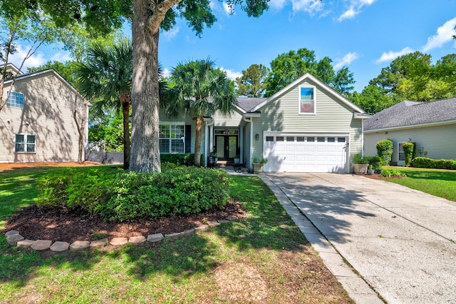 1231 Wild Olive Dr, Mount Pleasant, SC 29464 - traditional home with driveway, a garage, and a front yard