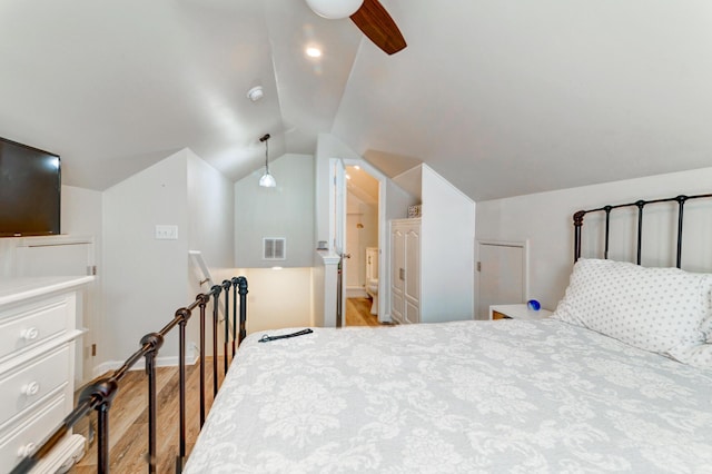 1231 Wild Olive Dr, Mount Pleasant, SC 29464 - bedroom featuring light wood-style floors, vaulted ceiling, and baseboards