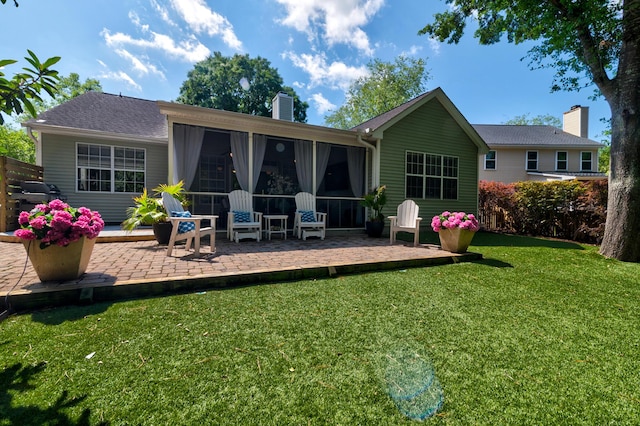1231 Wild Olive Dr, Mount Pleasant, SC 29464 - rear view of house with a patio area, a chimney, a sunroom, and a yard