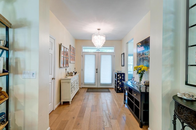 1231 Wild Olive Dr, Mount Pleasant, SC 29464 - foyer with a chandelier, light wood-type flooring, and french doors