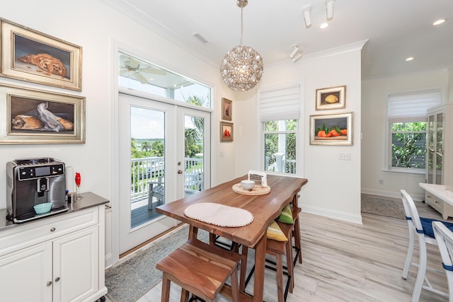 2226 Folly Rd, Charleston, SC 29412 - dining area with ornamental molding, healthy amount of natural light, light wood-style floors, french doors, and a chandelier