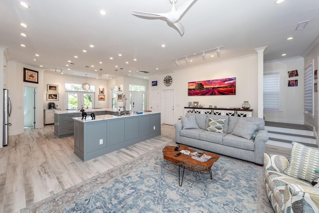 2226 Folly Rd, Charleston, SC 29412 - living room with crown molding, recessed lighting, light wood-type flooring, ceiling fan, and rail lighting