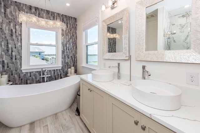 2226 Folly Rd, Charleston, SC 29412 - full bathroom featuring a soaking tub, double vanity, and a shower