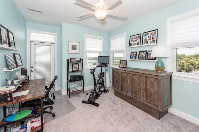 2226 Folly Rd, Charleston, SC 29412 - office area with light colored carpet, a ceiling fan, and healthy amount of natural light