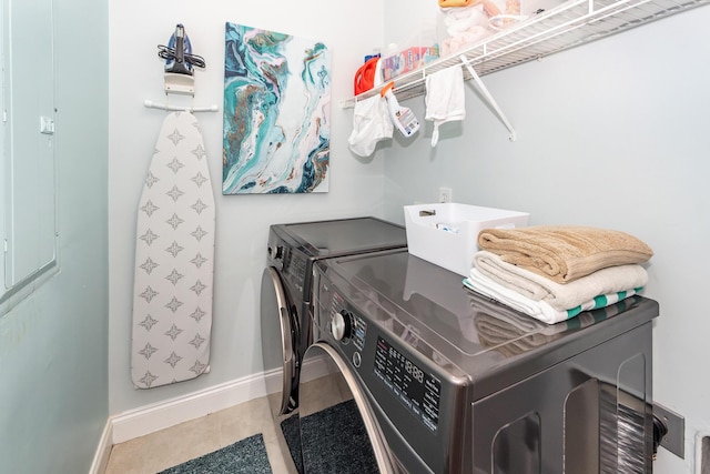 2226 Folly Rd, Charleston, SC 29412 - washroom with washing machine and clothes dryer and tile patterned flooring