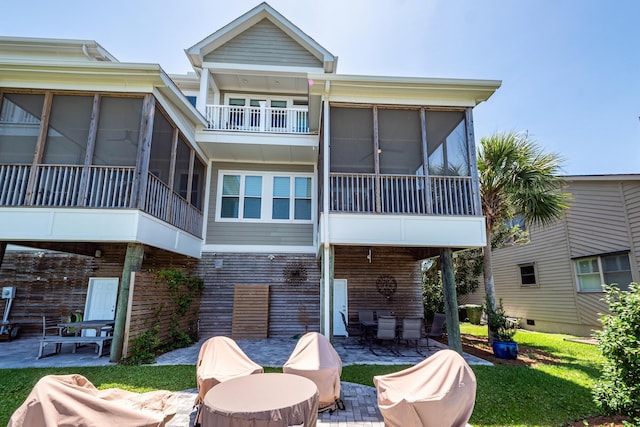 2226 Folly Rd, Charleston, SC 29412 - back of house featuring a sunroom, a patio area, and outdoor dining area