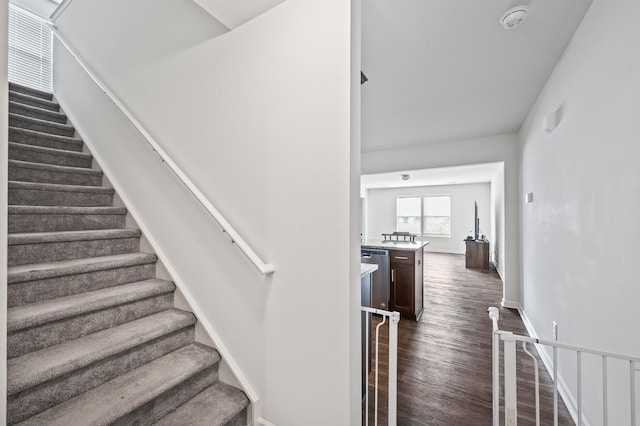 staircase featuring hardwood / wood-style floors