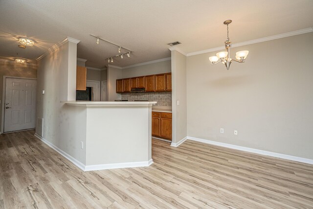45 Scyamore Ave Unit 623, Charleston, SC 29407 - kitchen featuring brown cabinetry, ornamental molding, refrigerator, a chandelier, and light wood-style flooring