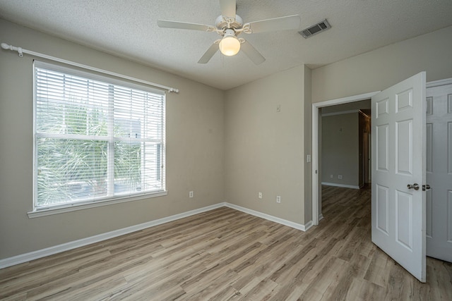 45 Scyamore Ave Unit 623, Charleston, SC 29407 - spare room with light wood finished floors, healthy amount of natural light, ceiling fan, and a textured ceiling