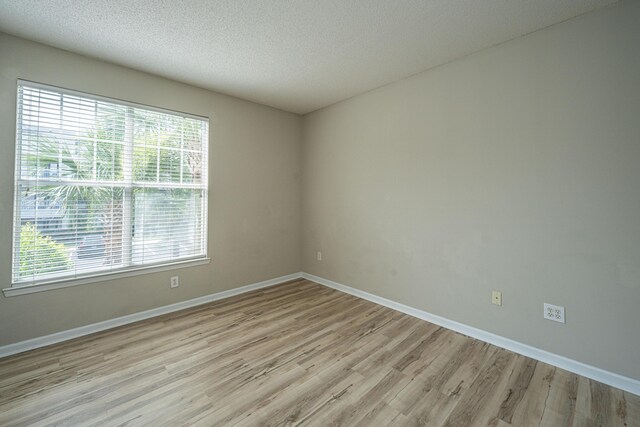 45 Scyamore Ave Unit 623, Charleston, SC 29407 - spare room with light wood-style floors, healthy amount of natural light, and a textured ceiling