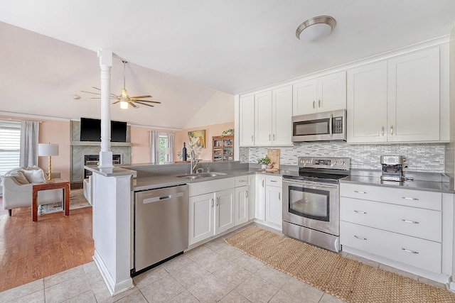 4636 Ashley View Ln, North Charleston, SC 29405 - kitchen featuring stainless steel appliances, white cabinets, open floor plan, ceiling fan, and a peninsula