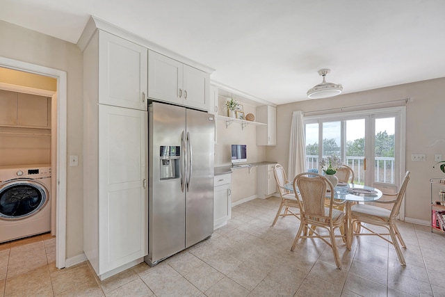 4636 Ashley View Ln, North Charleston, SC 29405 - kitchen with stainless steel fridge, washer / dryer, white cabinets, open shelves, and light tile patterned floors