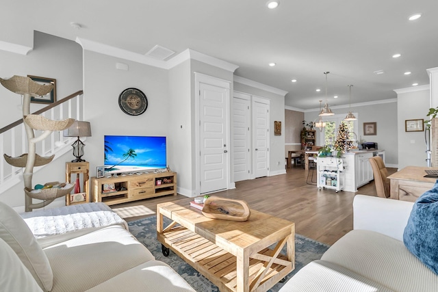 living room featuring dark wood-type flooring and ornamental molding