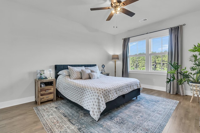 bedroom featuring hardwood / wood-style floors and ceiling fan