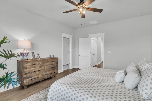 bedroom with ceiling fan and wood-type flooring