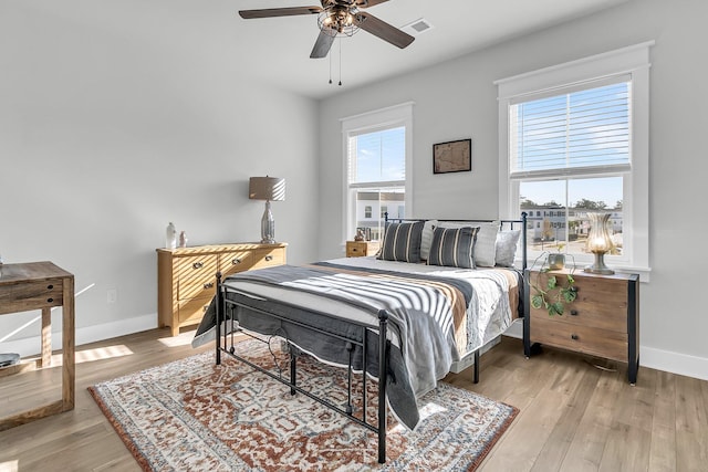 bedroom featuring ceiling fan and light hardwood / wood-style floors