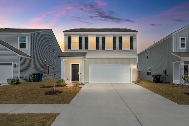 view of front of property with a garage and driveway