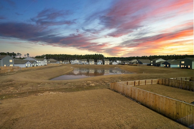 view of yard featuring a residential view and fence