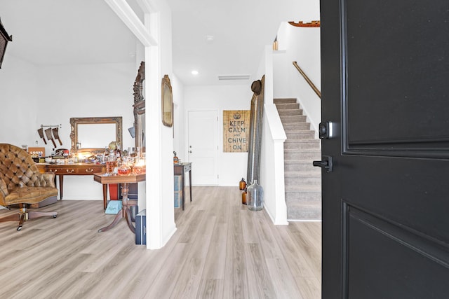 entryway with light hardwood / wood-style floors