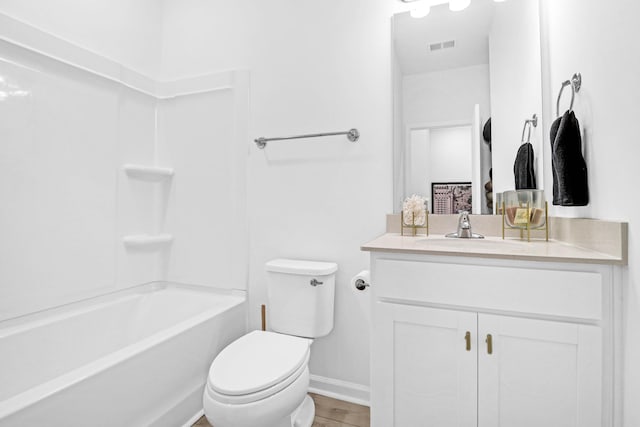 full bathroom featuring vanity, shower / bath combination, and toilet