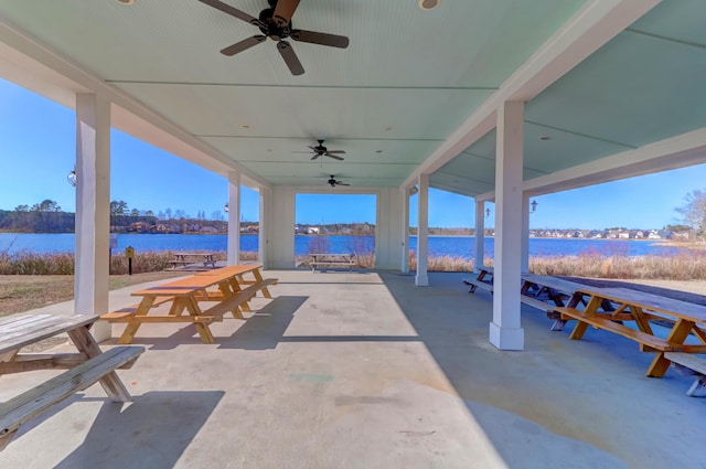 view of patio with a water view