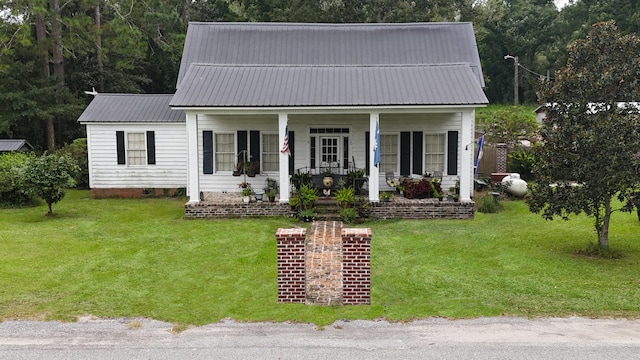 view of front of property with a porch and a front yard