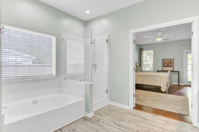 5406 Dwight Dr, North Charleston, SC 29420 - full bathroom featuring a garden tub, a shower stall, wood finished floors, and ceiling fan