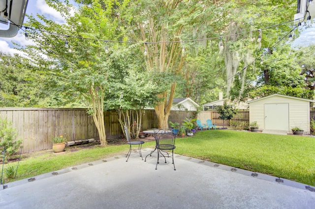5406 Dwight Dr, North Charleston, SC 29420 - fenced backyard featuring a patio and a storage shed