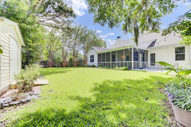 5406 Dwight Dr, North Charleston, SC 29420 - view of yard featuring a sunroom and a patio area