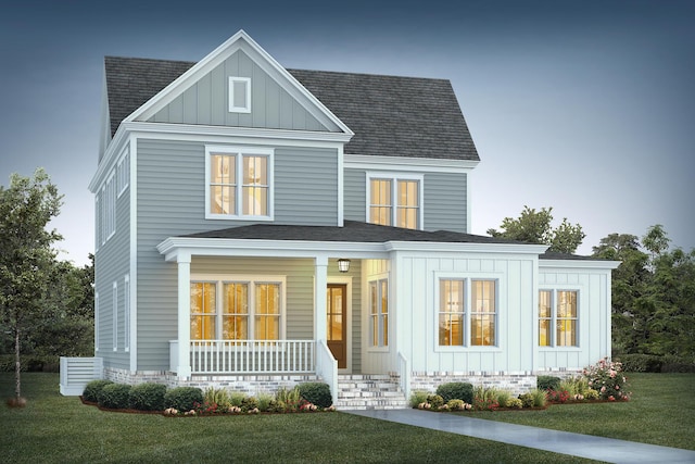 view of front facade featuring board and batten siding, a porch, and a front lawn