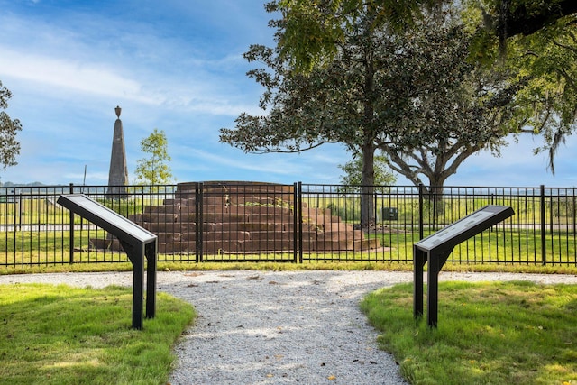 view of gate with fence