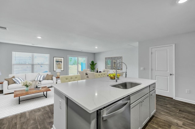 kitchen featuring a sink, dishwasher, open floor plan, and dark wood finished floors