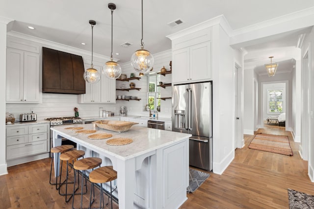 1474 Indian St, Mount Pleasant, SC 29464 - kitchen with appliances with stainless steel finishes, open shelves, custom range hood, a sink, and wood-type flooring
