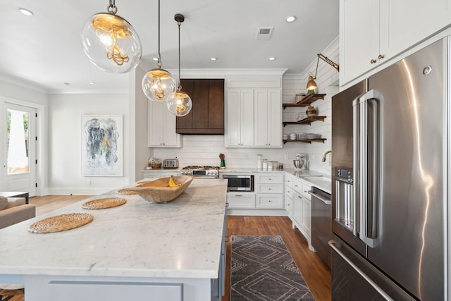1474 Indian St, Mount Pleasant, SC 29464 - kitchen with appliances with stainless steel finishes, open shelves, ornamental molding, light stone counters, and decorative light fixtures