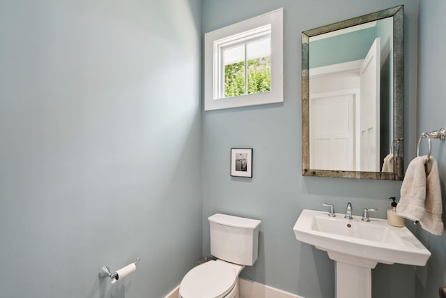1474 Indian St, Mount Pleasant, SC 29464 - bathroom featuring toilet, baseboards, and a sink