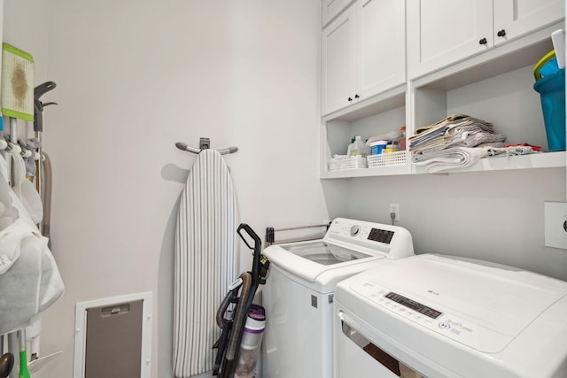 1474 Indian St, Mount Pleasant, SC 29464 - clothes washing area featuring washing machine and dryer and cabinet space