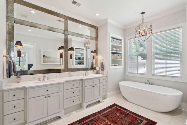 1474 Indian St, Mount Pleasant, SC 29464 - bathroom with a chandelier, a freestanding bath, double vanity, baseboards, and recessed lighting