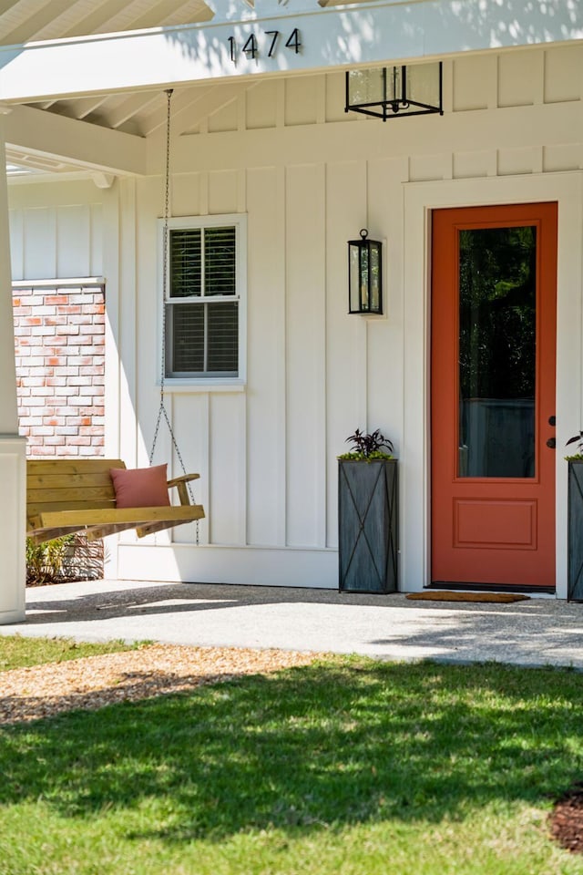 1474 Indian St, Mount Pleasant, SC 29464 - view of exterior entry with board and batten siding