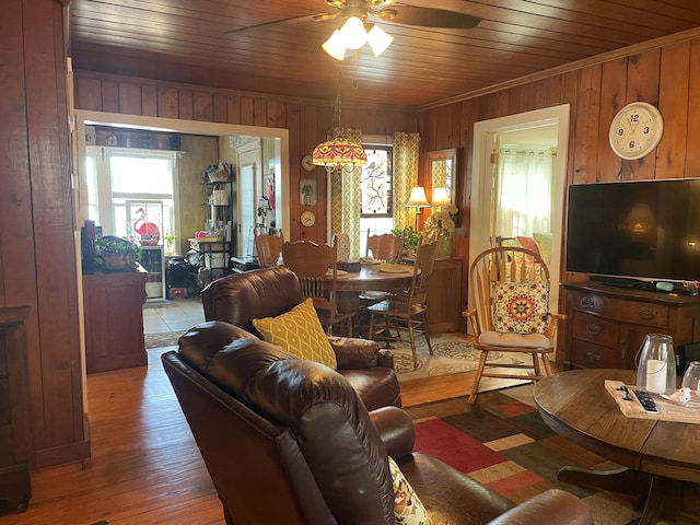 living room featuring wood ceiling, ceiling fan, and light hardwood / wood-style flooring