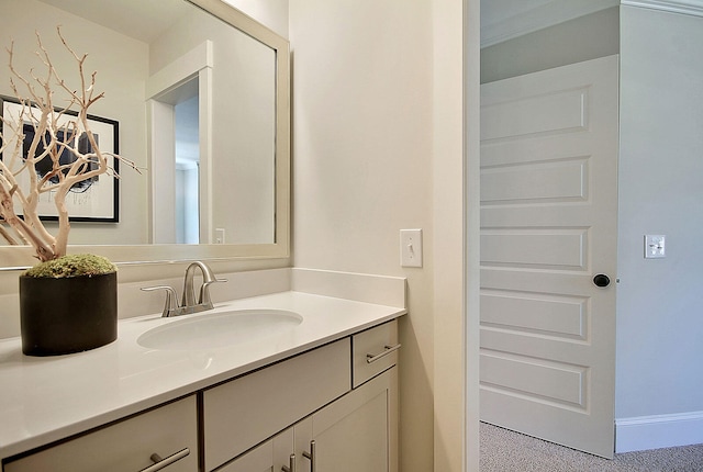 bathroom with vanity and baseboards