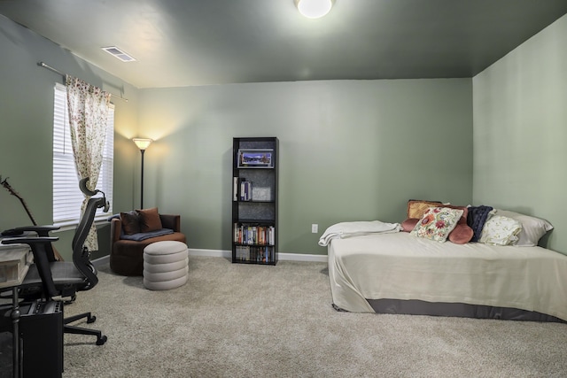 bedroom featuring light carpet