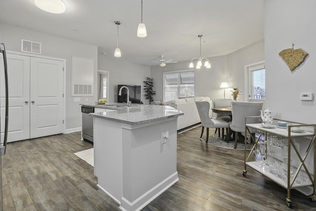 kitchen with ceiling fan with notable chandelier, pendant lighting, dishwasher, dark hardwood / wood-style flooring, and sink