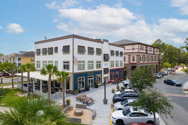 view of building exterior with an outdoor fire pit