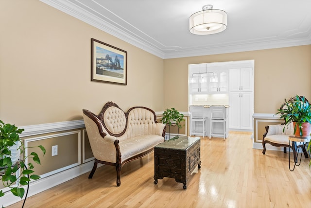 1551 Hutton Pl, Charleston, SC 29407 - sitting room featuring ornamental molding, light wood-style floors, and a wainscoted wall
