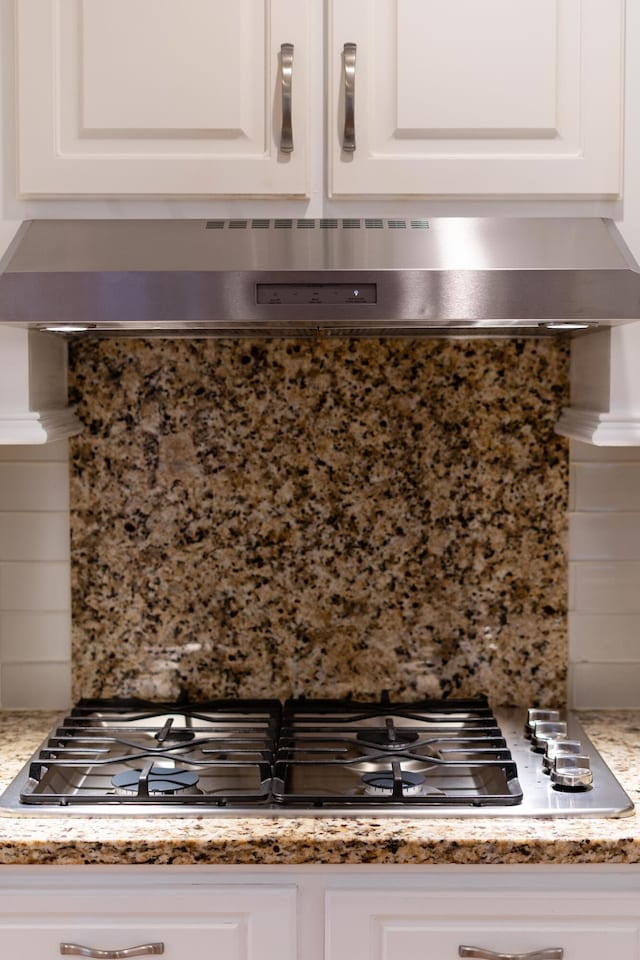 1551 Hutton Pl, Charleston, SC 29407 - kitchen view of tasteful backsplash, stainless steel gas stovetop, and white cabinets