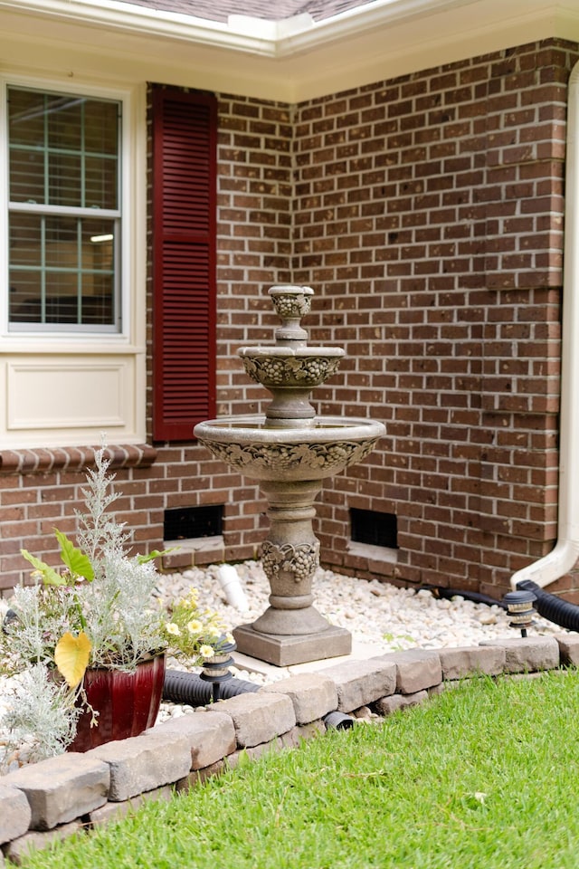 1551 Hutton Pl, Charleston, SC 29407 - exterior view of brick siding, a downspout, and gutters
