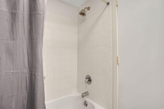 bathroom with shower / bathtub combination with curtain